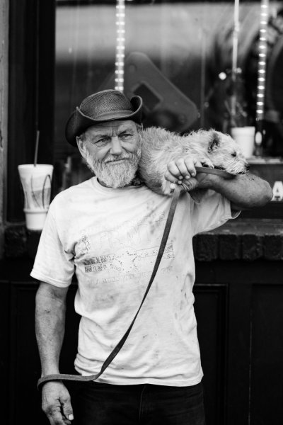 man with dog candid photography tips